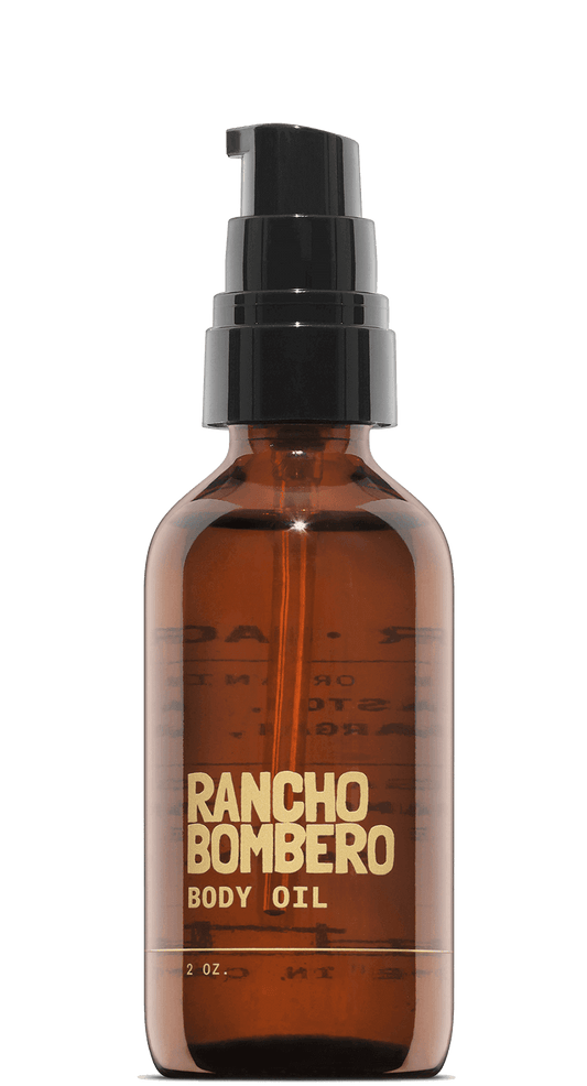 Travel-size all-purpose body oil in amber bottle